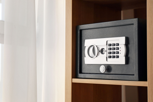 black safe with a silver lock and a black keypad